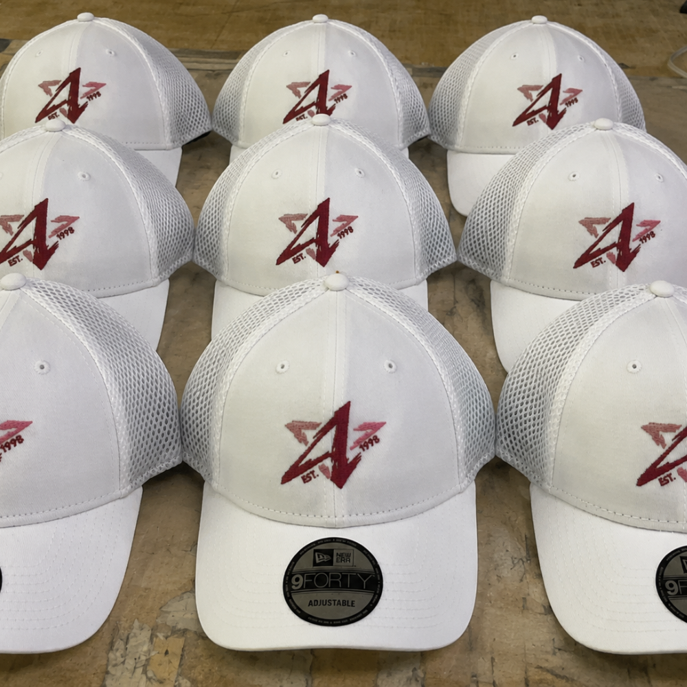 Set of white mesh caps with red embroidered logo