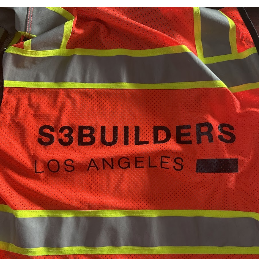 Orange high-visibility safety vest with black S3 Builders Los Angeles screen print