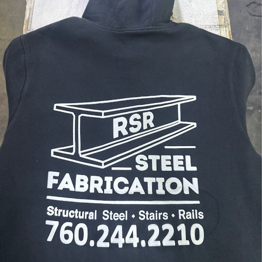Back of a black hoodie with large white steel fabrication screen print