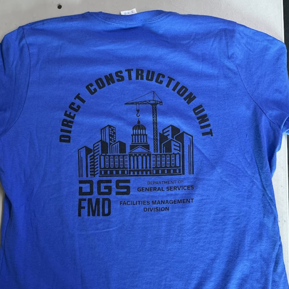 Bright blue Direct Construction Unit shirt with oversized black back print